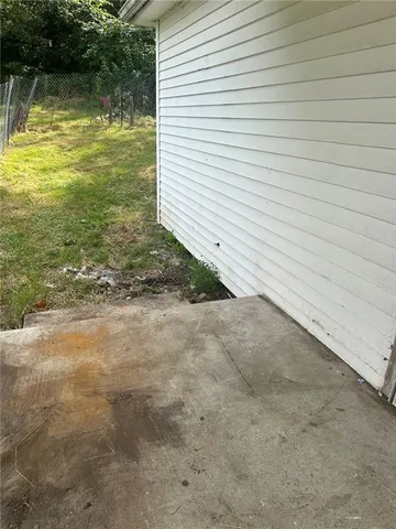 a backyard of a house with lots of green space