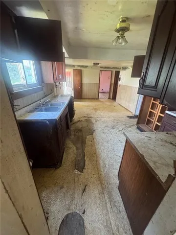 a view of a house with a yard and a garage