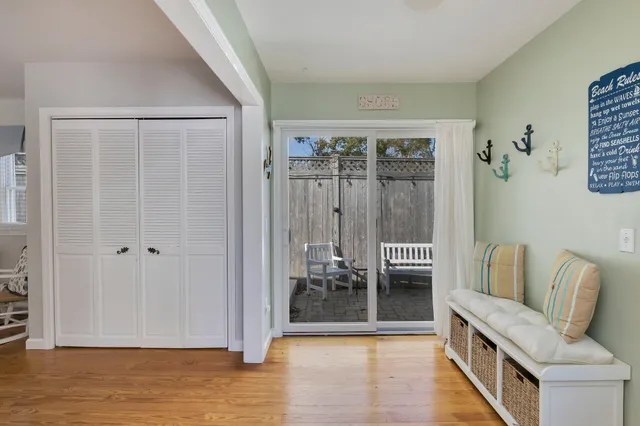 a view of a hallway with wooden shelves