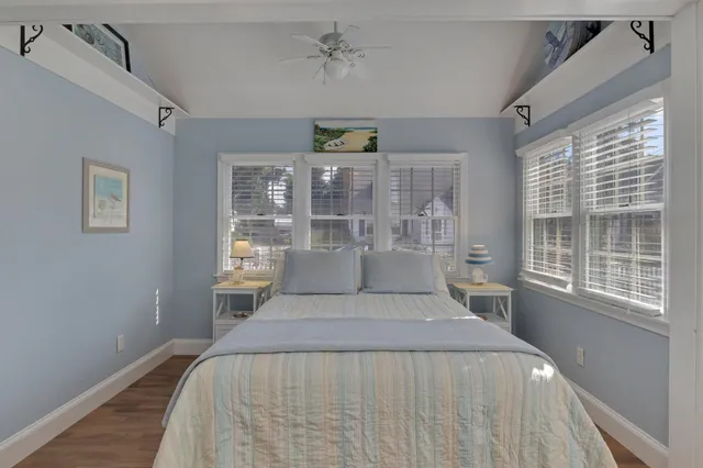 a bedroom with a large bed and a window