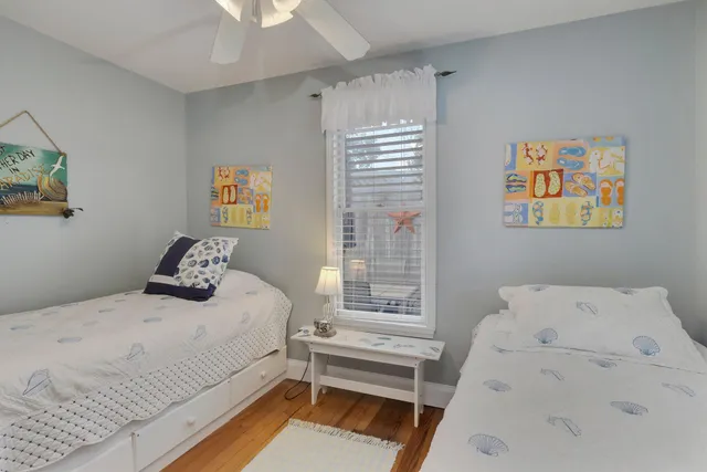 a bedroom with bed and window