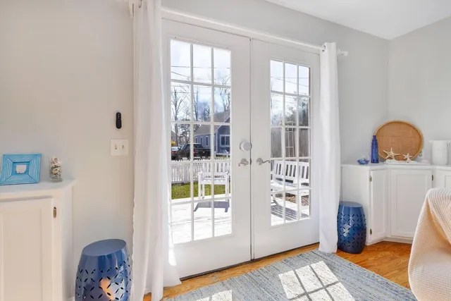 a view of a bedroom with furniture and window