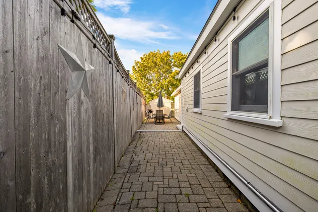 a view of a wooden door with a house