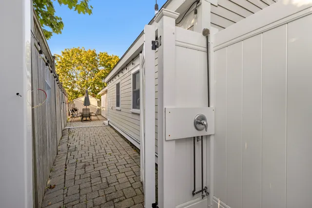 a view of a chair and tables in the patio