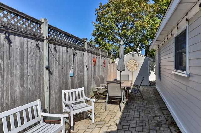a view of a small house with a tub