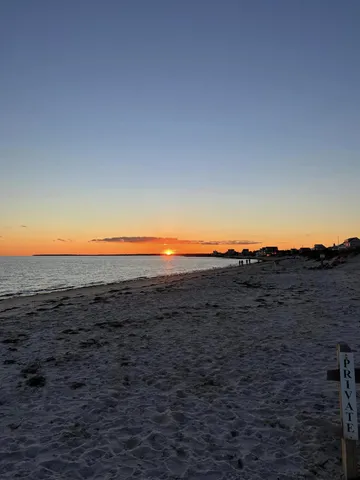 a view of a yard with an ocean view