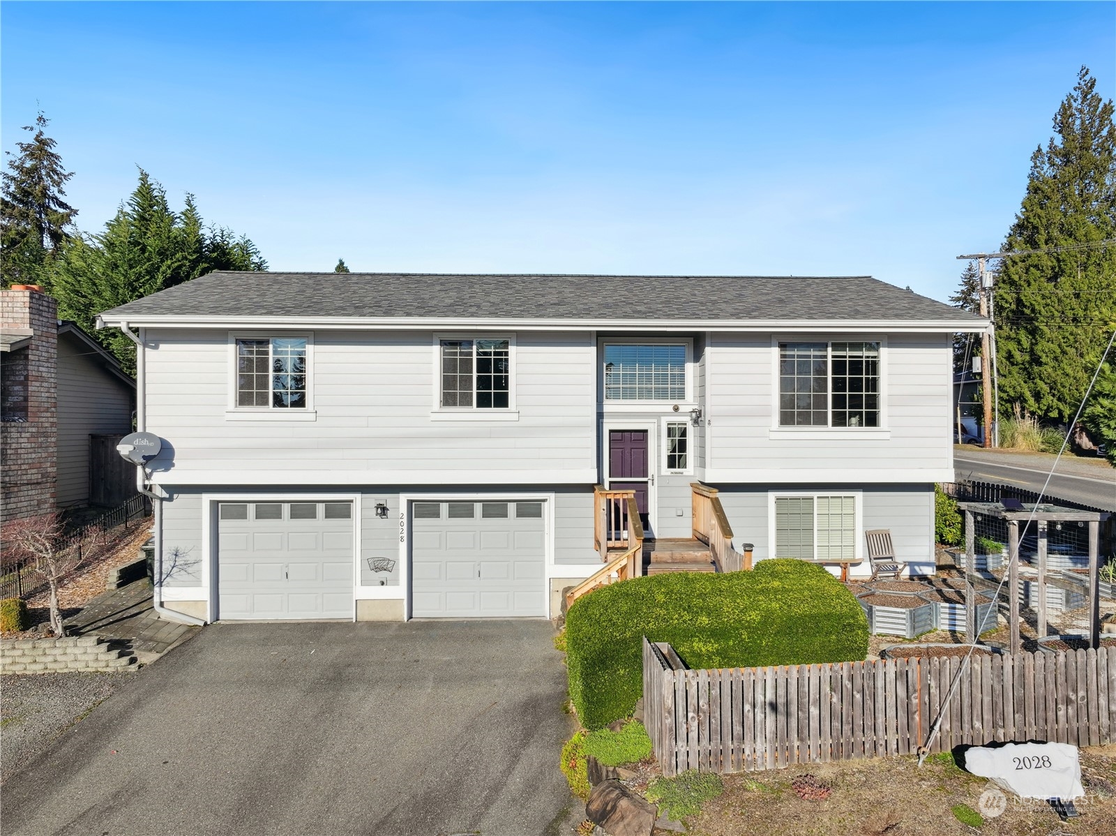2028 Northeast 12th Street Renton, WA 98056 - Photo 1 of 40 a front view of a house with a yard