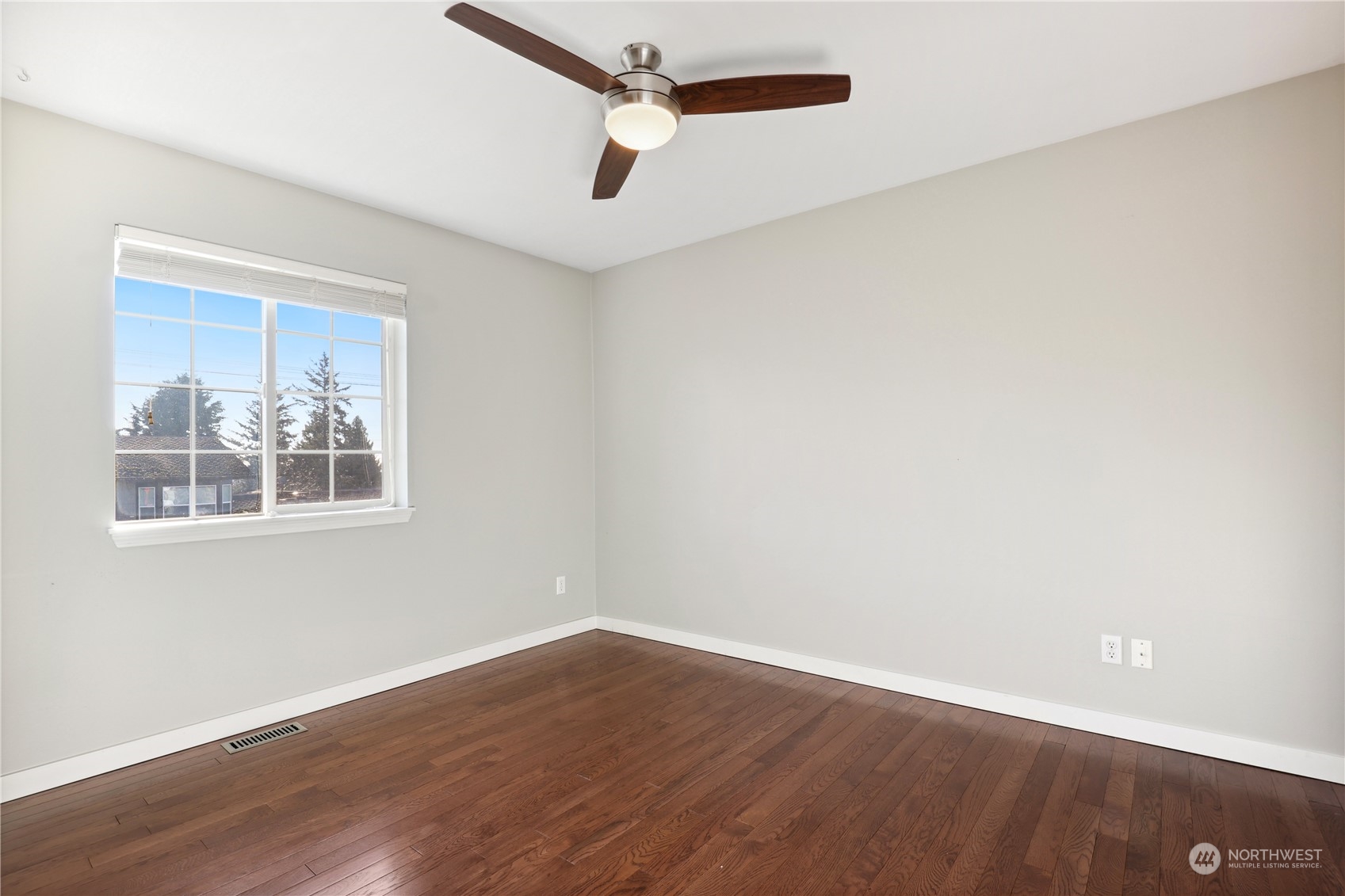 2028 Northeast 12th Street Renton, WA 98056 - Photo 12 of 40 a view of a big room with wooden floor and windows