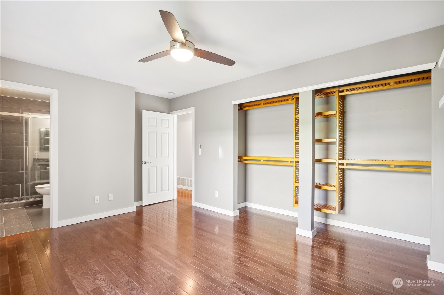 2028 Northeast 12th Street Renton, WA 98056 - Photo 15 of 40 a view of an empty room with wooden floor and a window