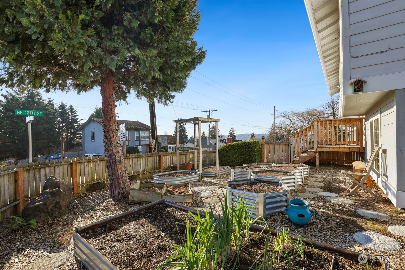 2028 Northeast 12th Street Renton, WA 98056 - Photo 27 of 40 a view of a patio with table and chairs and potted plants