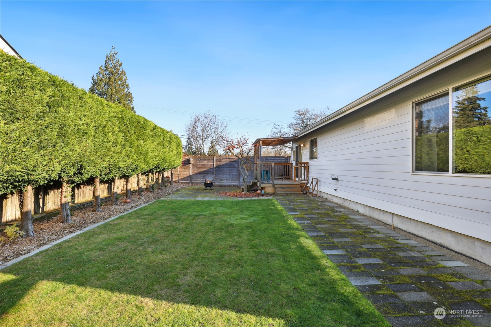 2028 Northeast 12th Street Renton, WA 98056 - Photo 29 of 40 a backyard of a house with lots of green space