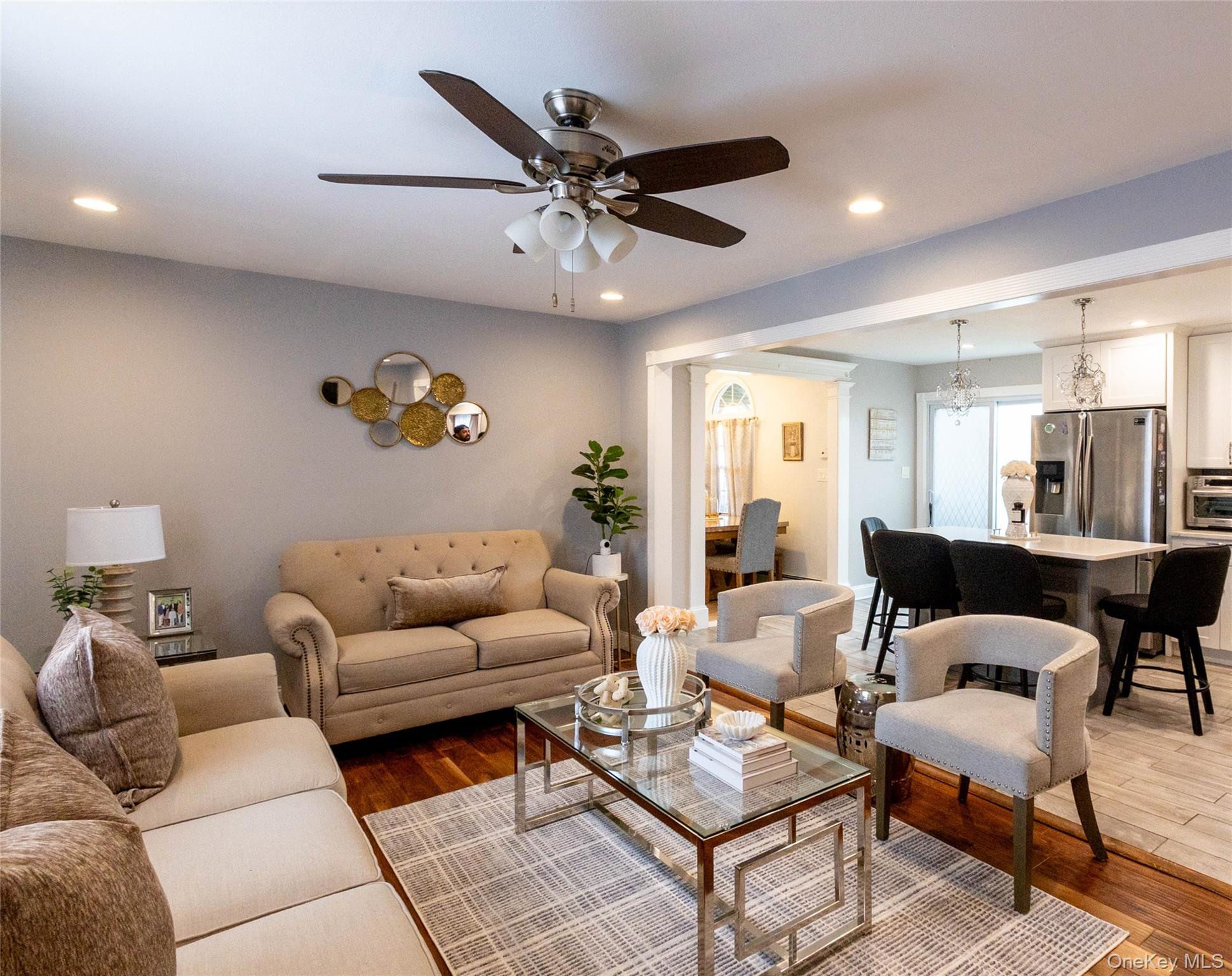 151 Cheltenham Road West Babylon, NY 11704 - Photo 14 of 42 Living area featuring wood-finish flooring, recessed lighting, and a ceiling fan