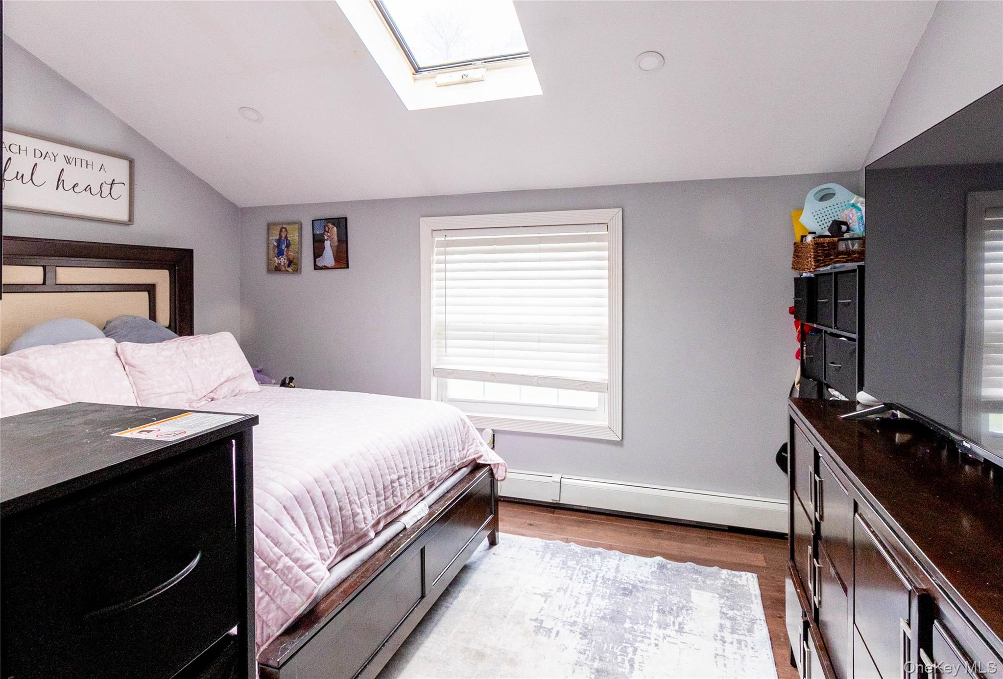 151 Cheltenham Road West Babylon, NY 11704 - Photo 39 of 42 Vaulted ceiling featuring a skylight and recessed lighting
