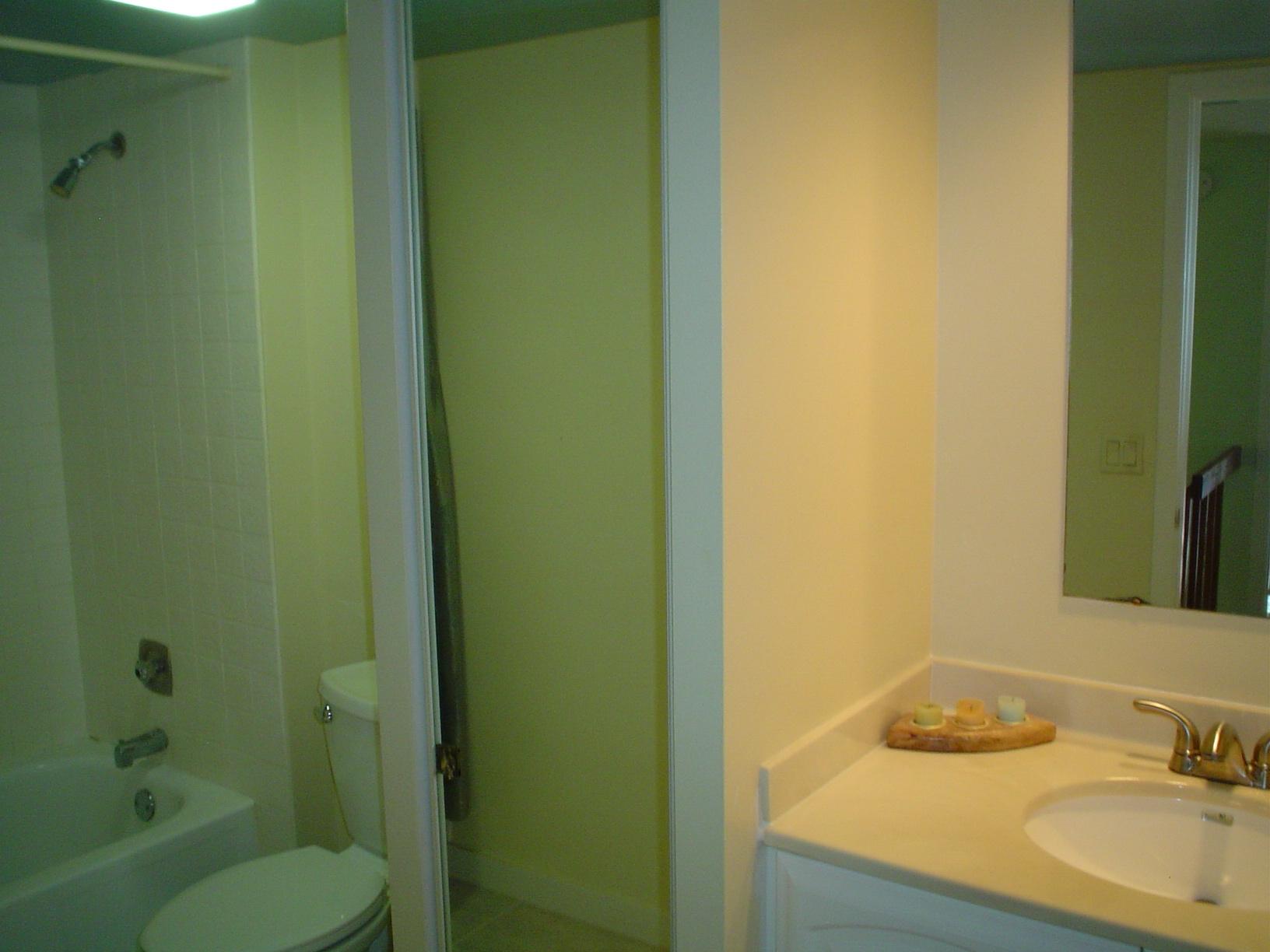 1445 Masters Circle, Unit 157 Delray Beach, FL 33445 - Photo 15 of 23 a bathroom with a granite countertop sink toilet and shower