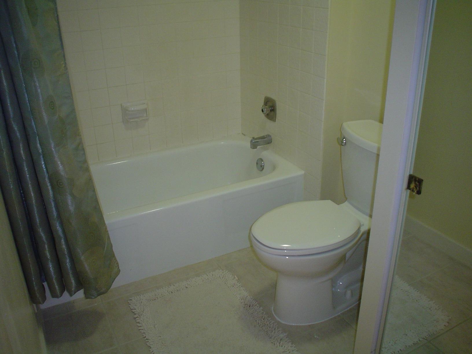1445 Masters Circle, Unit 157 Delray Beach, FL 33445 - Photo 16 of 23 a bathroom with a toilet and a shower