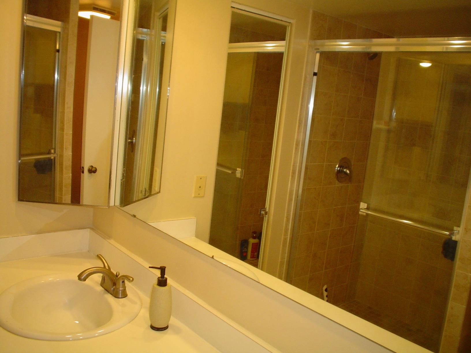 1445 Masters Circle, Unit 157 Delray Beach, FL 33445 - Photo 17 of 23 a bathroom with a tub and shower