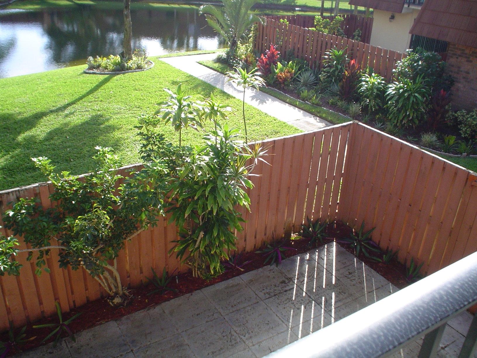 1445 Masters Circle, Unit 157 Delray Beach, FL 33445 - Photo 19 of 23 a view of a backyard with plants
