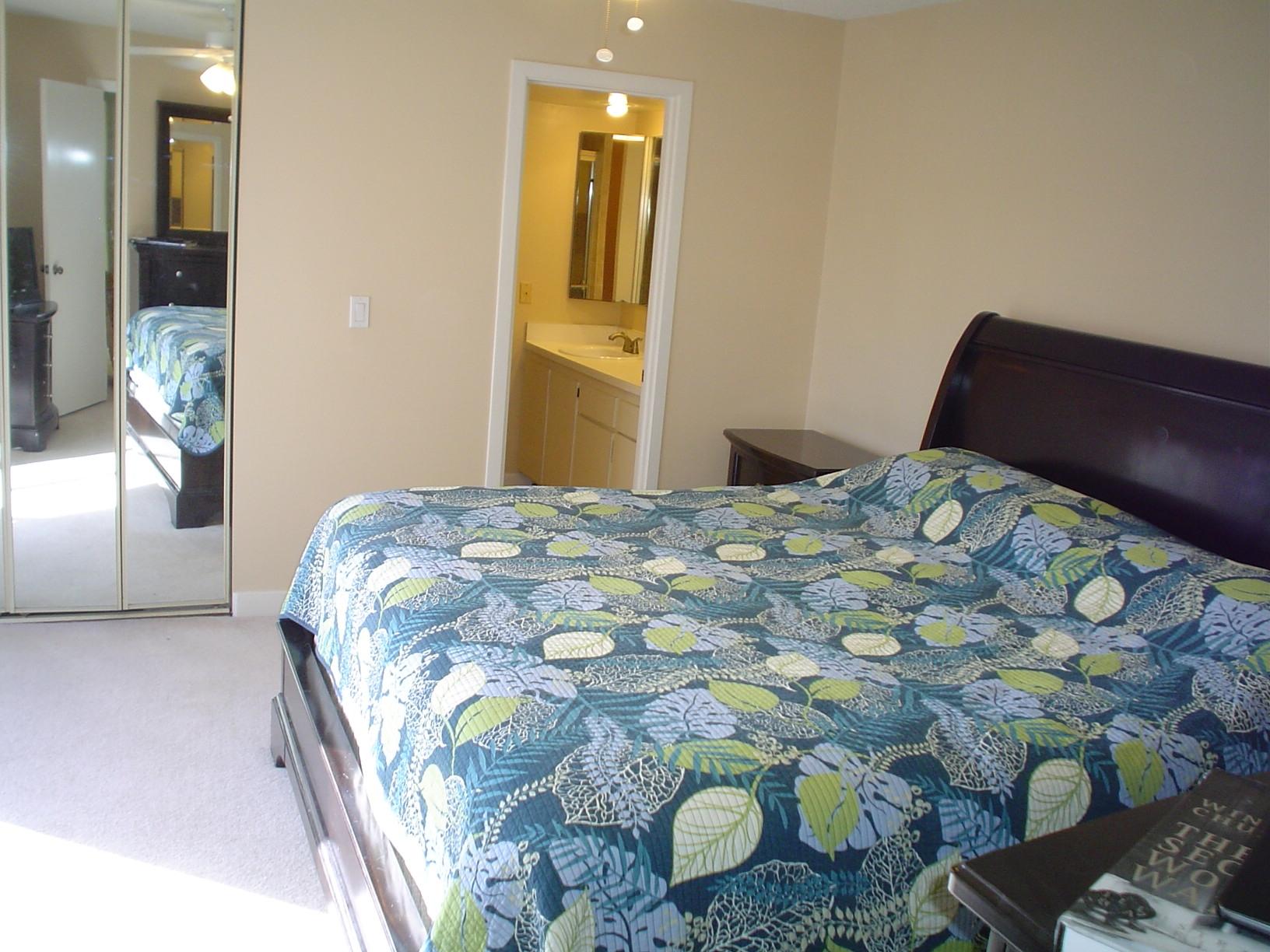 1445 Masters Circle, Unit 157 Delray Beach, FL 33445 - Photo 21 of 23 a bedroom with a bed and dryer