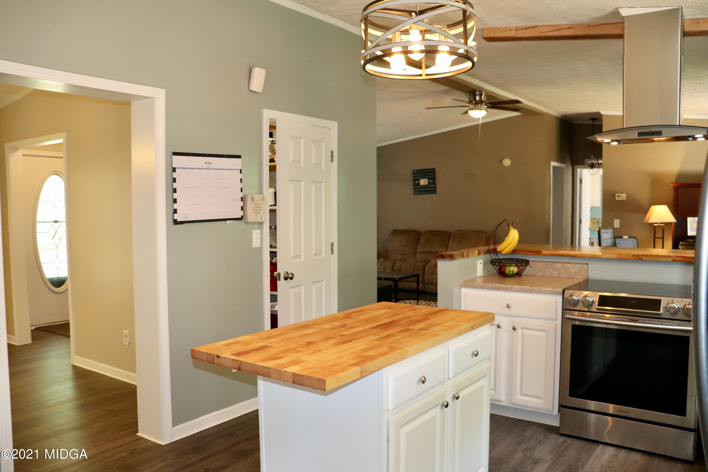 213 Browns Crossing Road Northwest Haddock, GA 31033 - Photo 11 of 28 a kitchen with a stove and a refrigerator