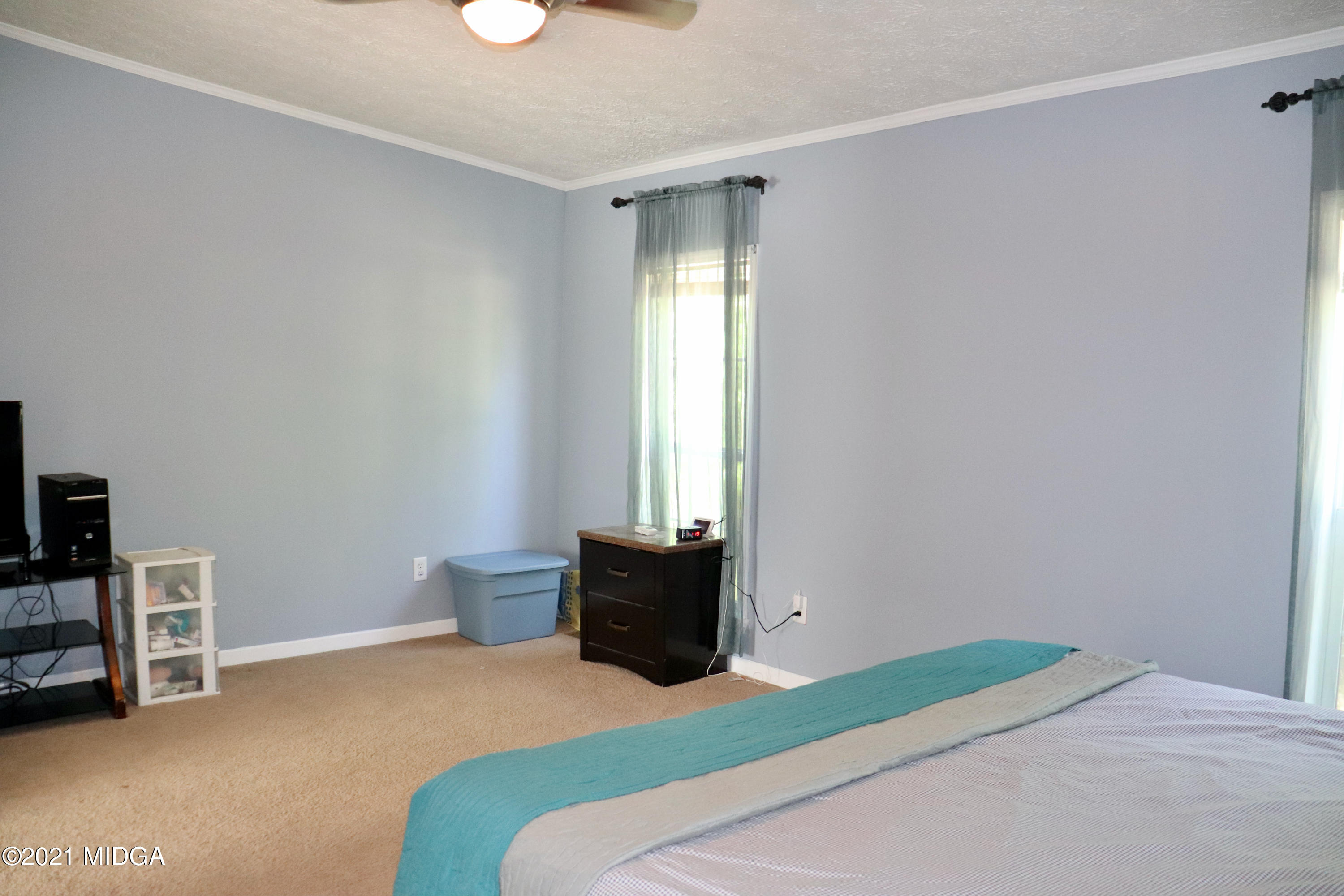 213 Browns Crossing Road Northwest Haddock, GA 31033 - Photo 13 of 28 a bedroom with a bed and window