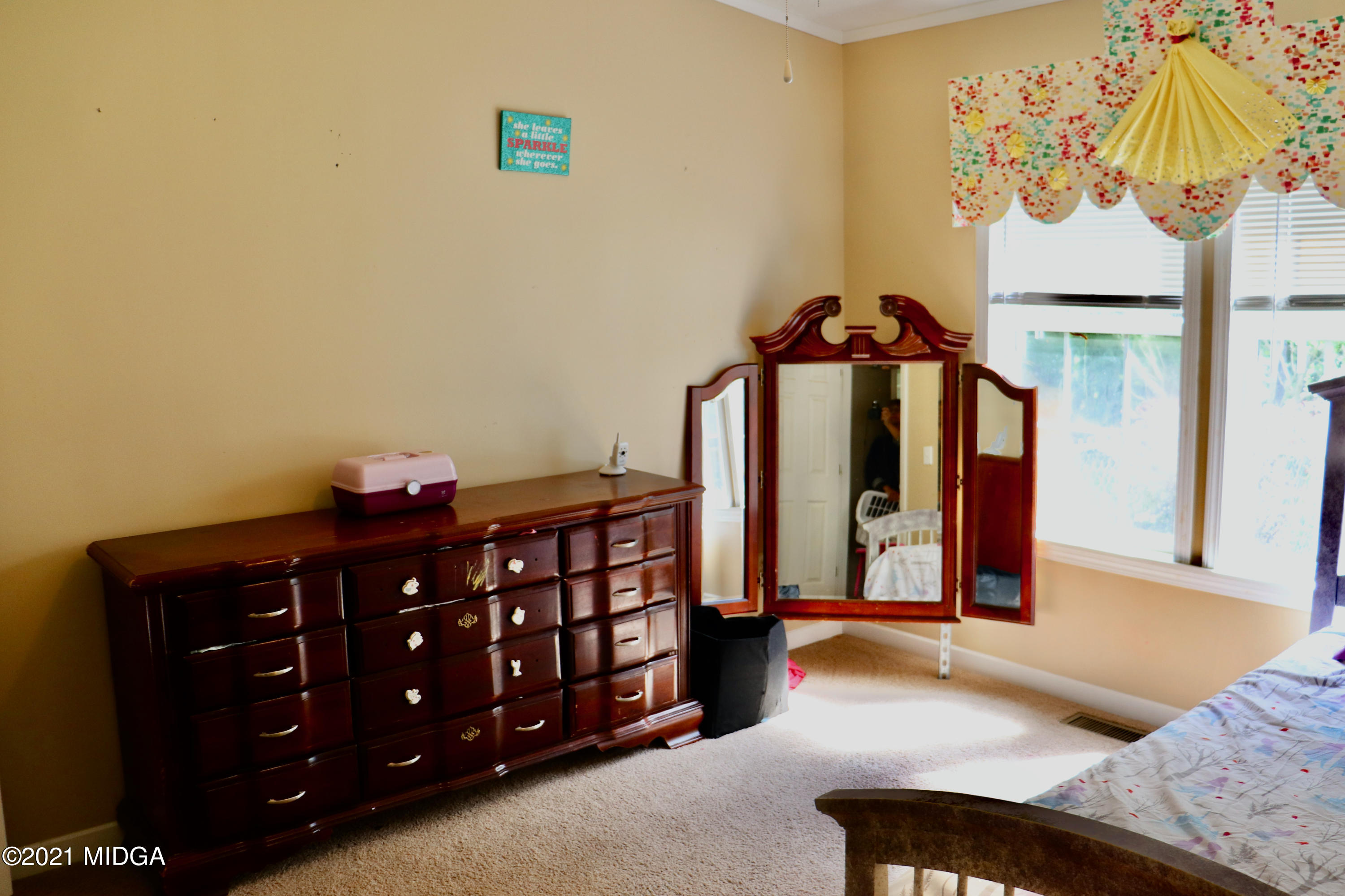 213 Browns Crossing Road Northwest Haddock, GA 31033 - Photo 18 of 28 a bedroom with a bed and wooden floor