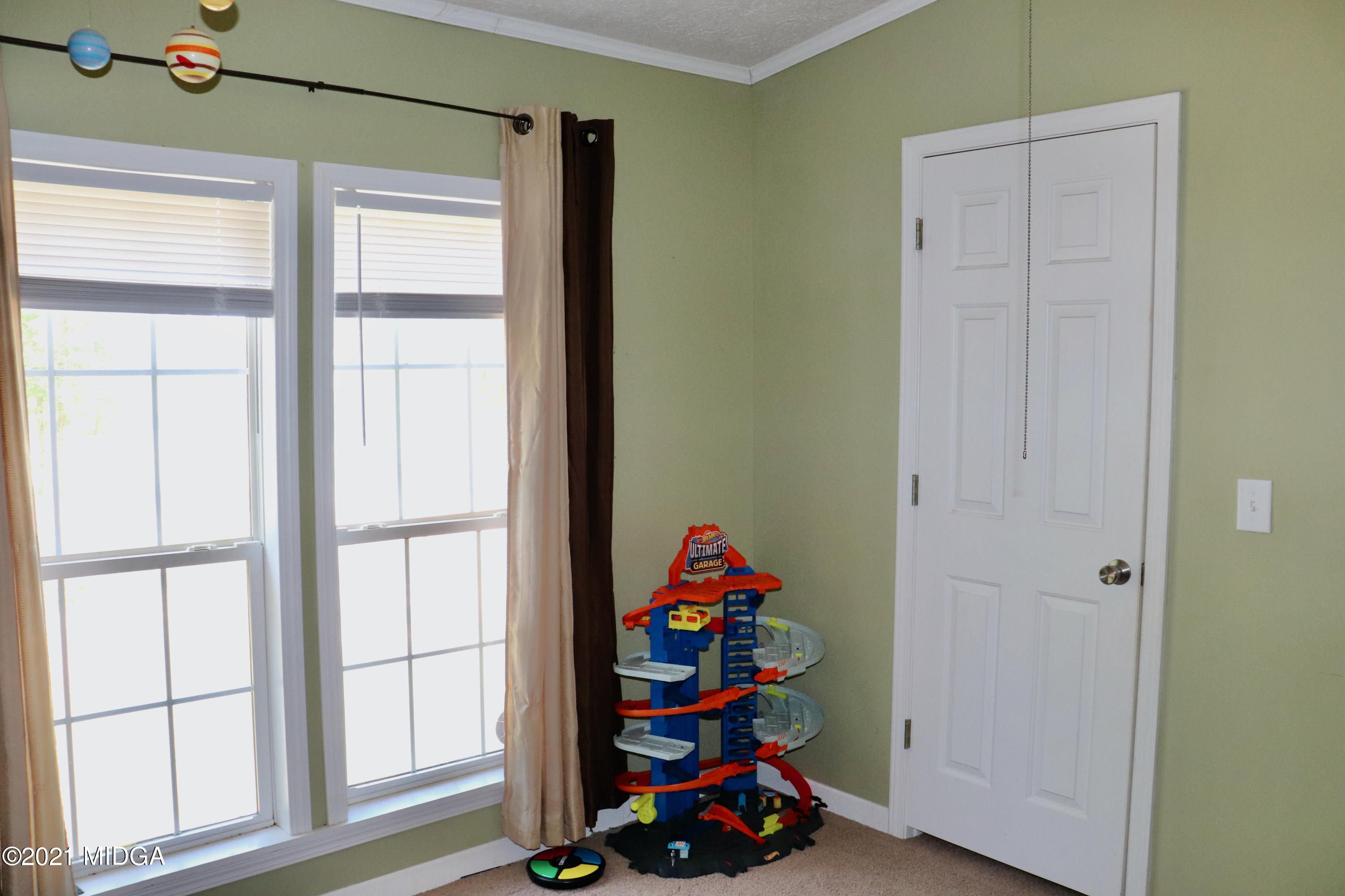 213 Browns Crossing Road Northwest Haddock, GA 31033 - Photo 20 of 28 a room with toys and a window