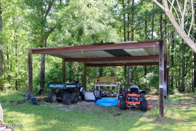 213 Browns Crossing Road Northwest Haddock, GA 31033 - Photo 24 of 28 a view of backyard with seating space and green space