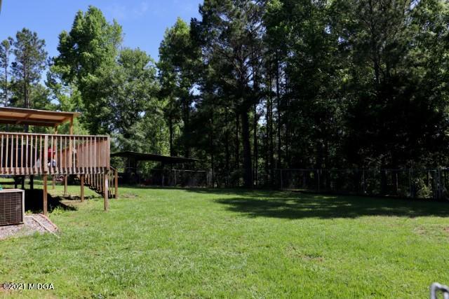 213 Browns Crossing Road Northwest Haddock, GA 31033 - Photo 27 of 28 a view of a chair and yard in the back