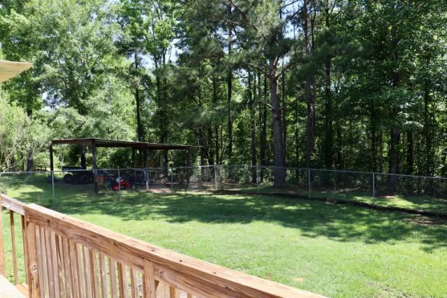 213 Browns Crossing Road Northwest Haddock, GA 31033 - Photo 28 of 28 a view of a backyard with a garden