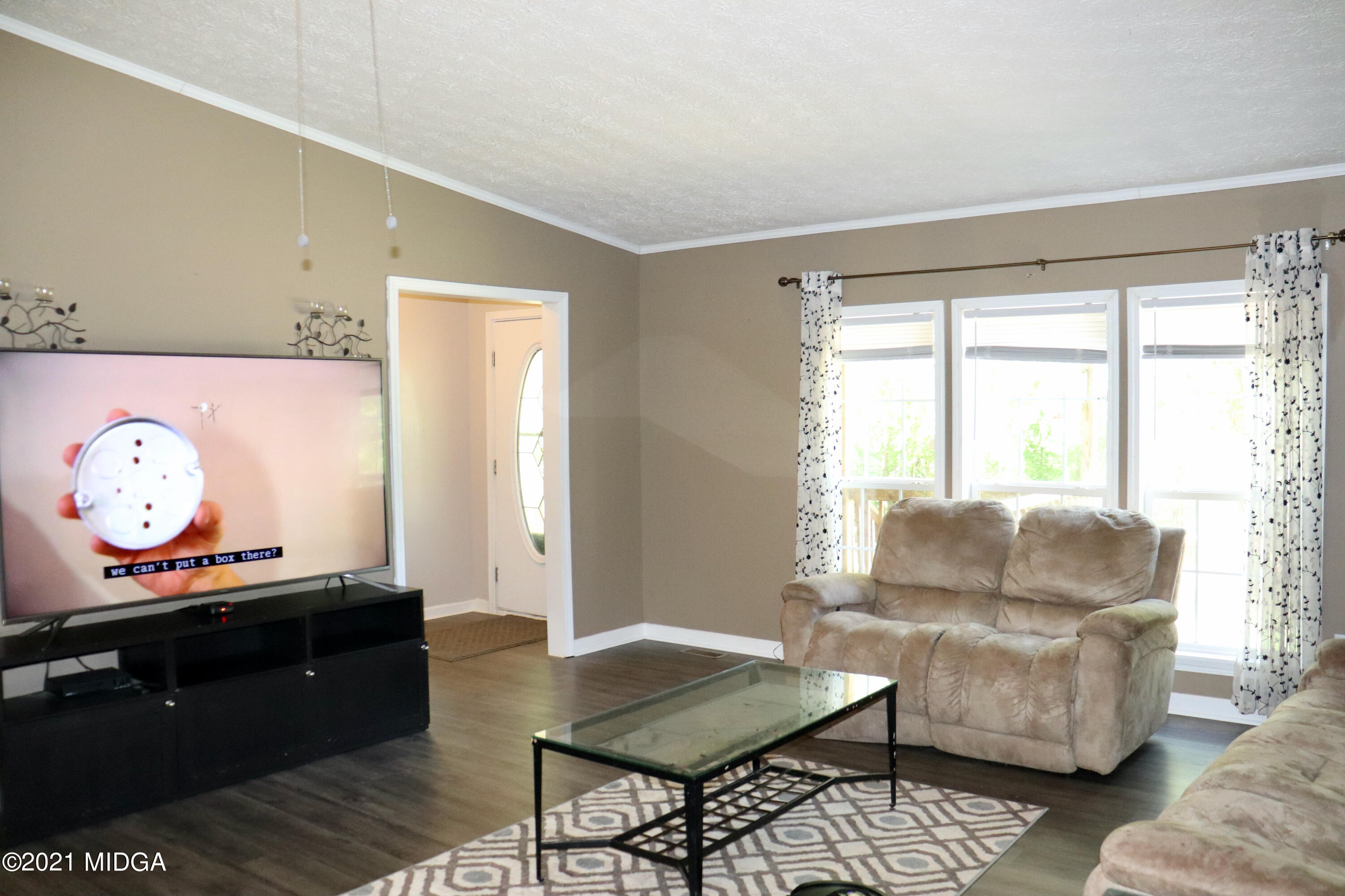 213 Browns Crossing Road Northwest Haddock, GA 31033 - Photo 4 of 28 a living room with furniture and a window