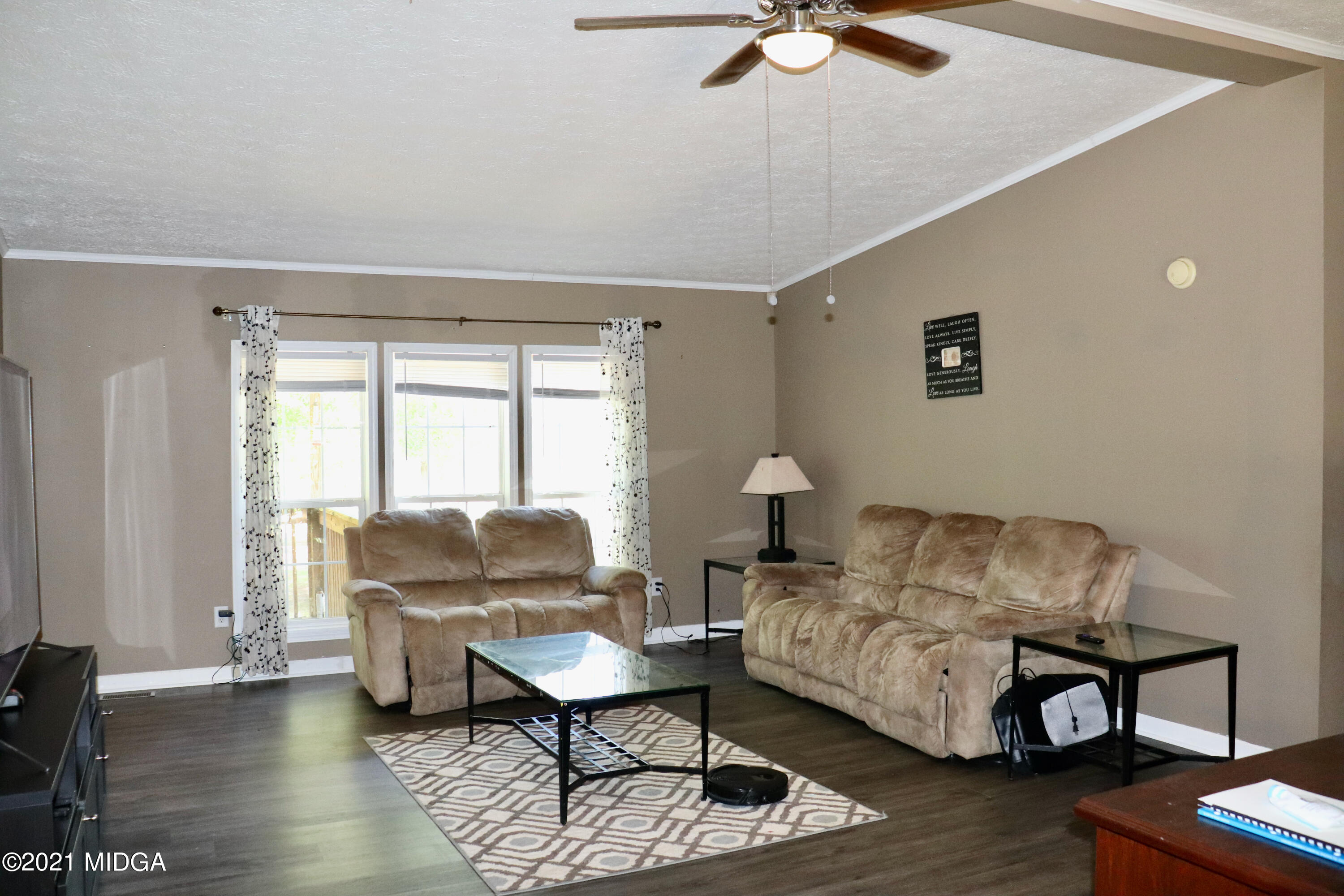 213 Browns Crossing Road Northwest Haddock, GA 31033 - Photo 5 of 28 a living room with furniture and a window