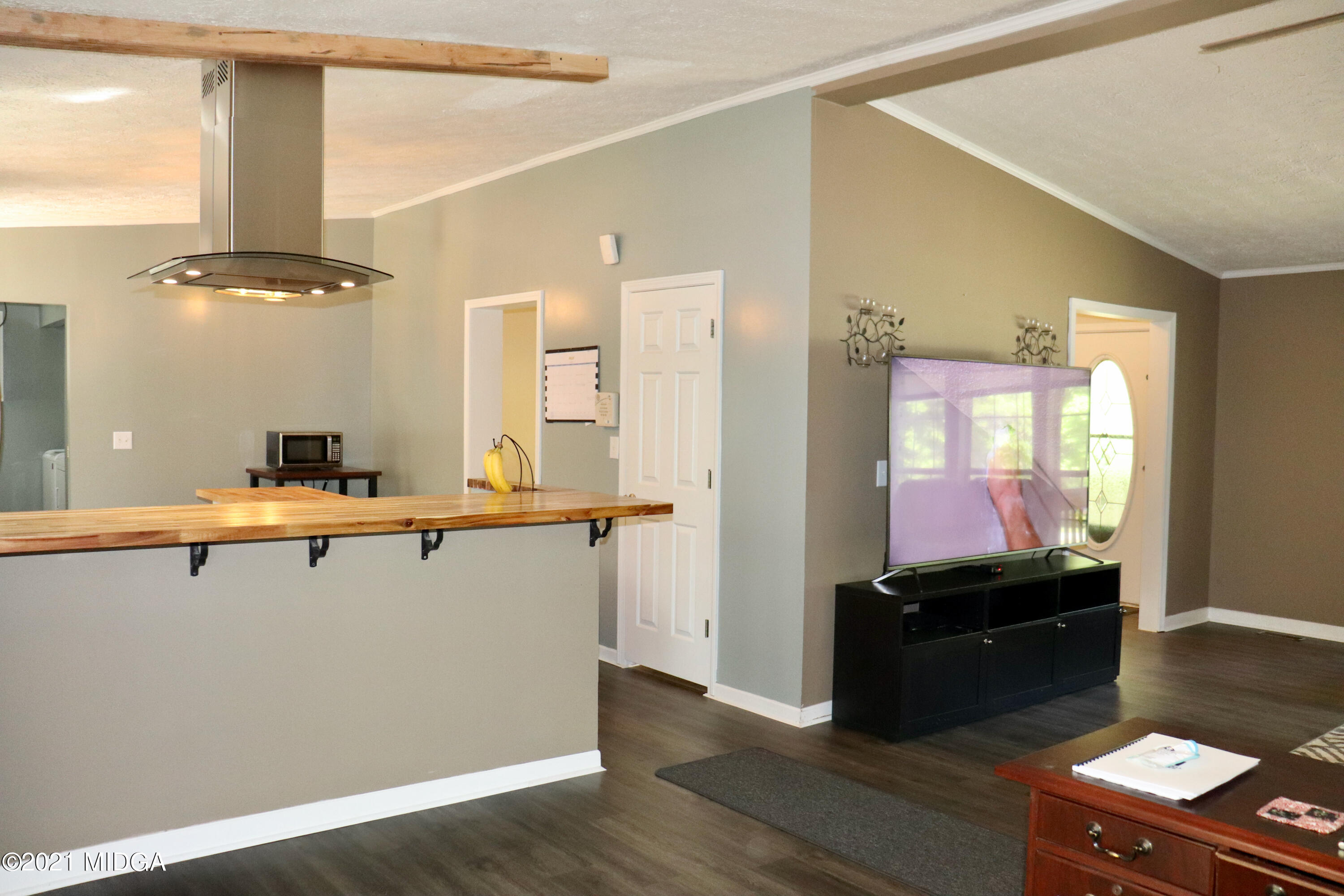 213 Browns Crossing Road Northwest Haddock, GA 31033 - Photo 7 of 28 a kitchen with a sink and a refrigerator
