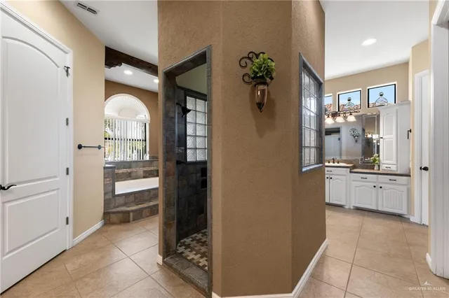 a room with a walk in closet and a bathroom
