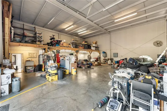 a view of house with outdoor space and parking