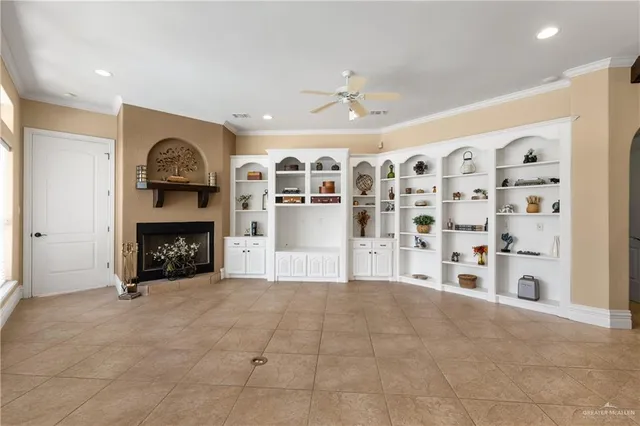 a view of a livingroom with a fireplace and a chandelier