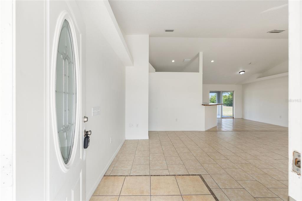 15434 Southwest 23rd Court Road Ocala, FL 34473 - Photo 5 of 41 a view of a hallway with wooden floors