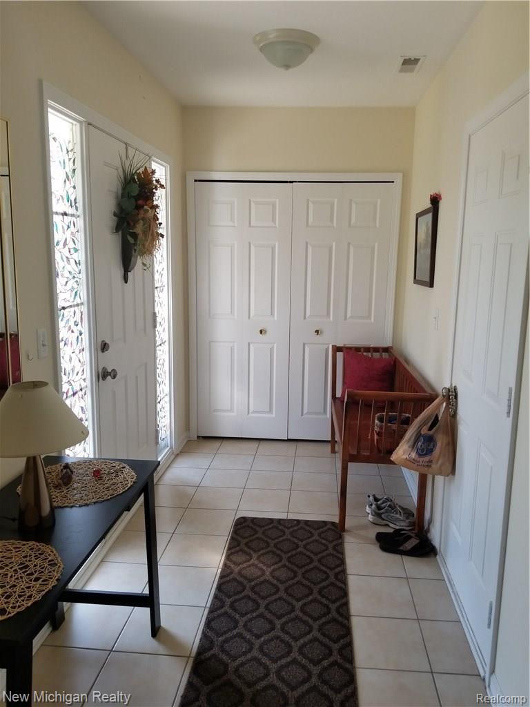 45960 Rhodes Drive Macomb, MI 48044 - Photo 2 of 18 Large foyer with entry door and garage door, plus large closet