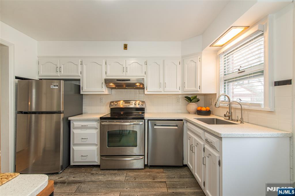 408 Washington Avenue Montclair, NJ 07042 - Photo 13 of 42 a kitchen with kitchen island a sink stove and refrigerator