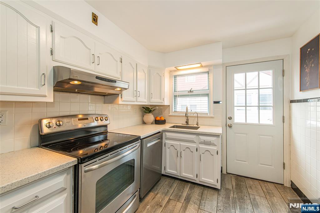 408 Washington Avenue Montclair, NJ 07042 - Photo 16 of 42 a kitchen with a sink stove and cabinets