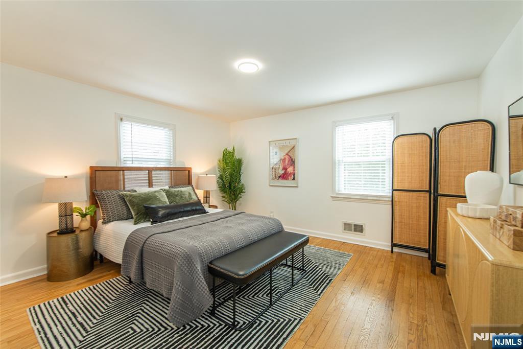408 Washington Avenue Montclair, NJ 07042 - Photo 19 of 42 a bedroom with a bed and wooden floor