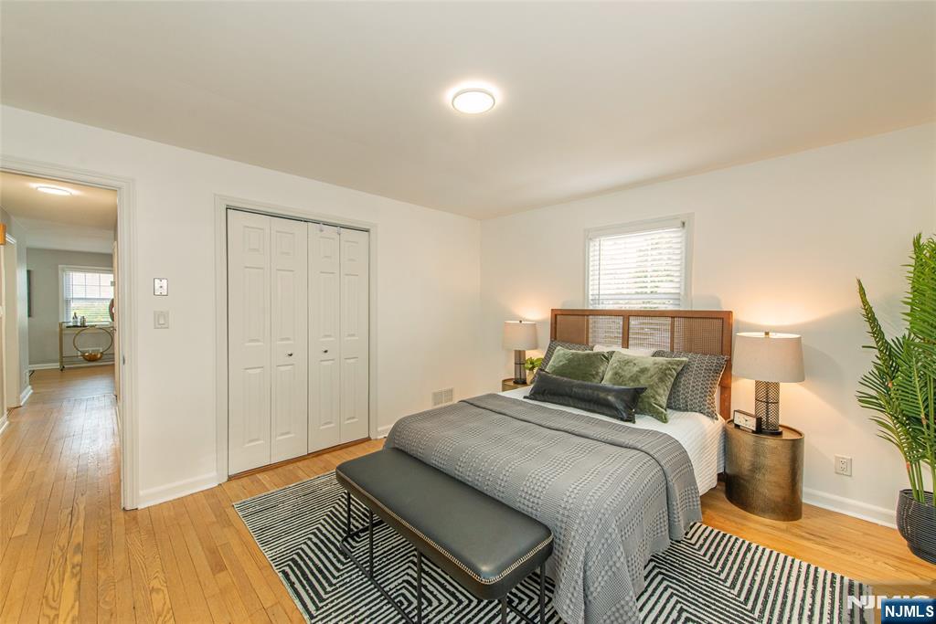 408 Washington Avenue Montclair, NJ 07042 - Photo 20 of 42 a bedroom with a bed and wooden floor