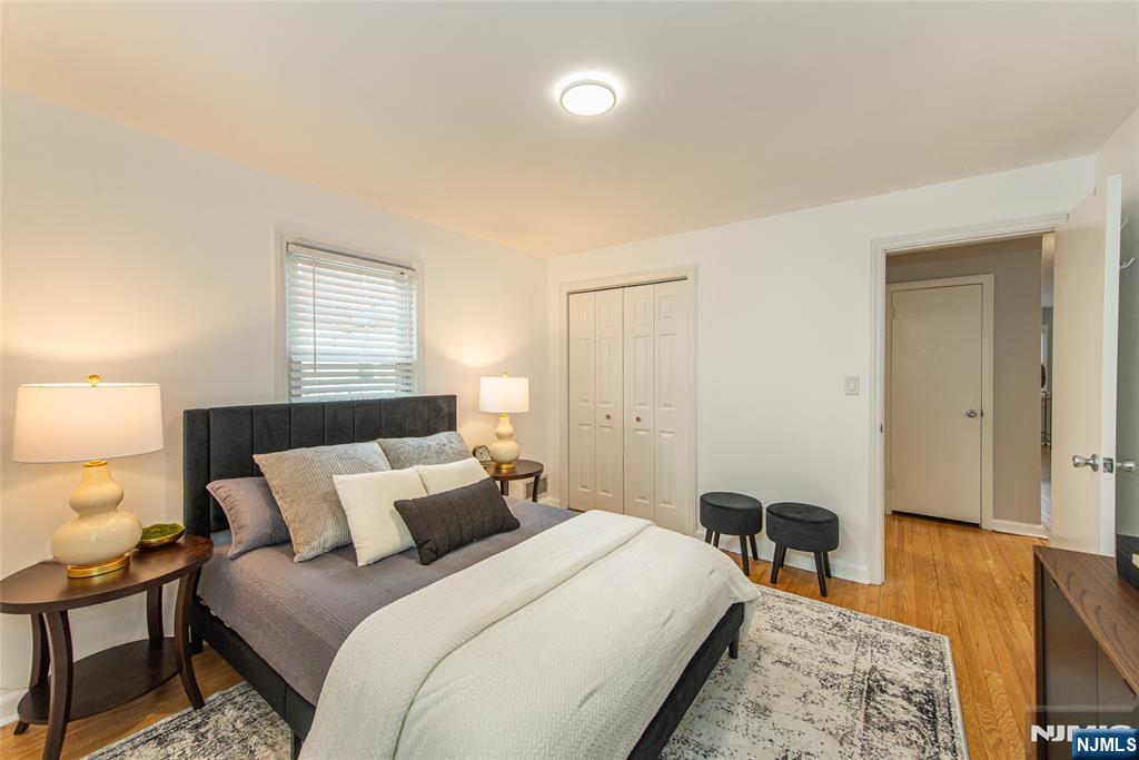 408 Washington Avenue Montclair, NJ 07042 - Photo 25 of 42 a bedroom with a bed and wooden floor
