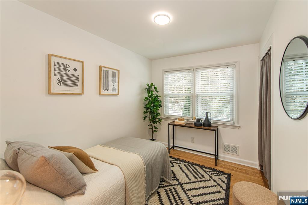 408 Washington Avenue Montclair, NJ 07042 - Photo 26 of 42 a bedroom with a bed and wooden floor