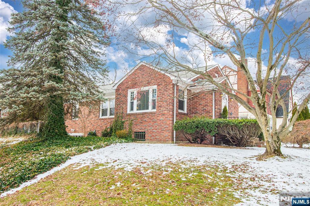 408 Washington Avenue Montclair, NJ 07042 - Photo 36 of 42 a front view of a house with a yard and garage