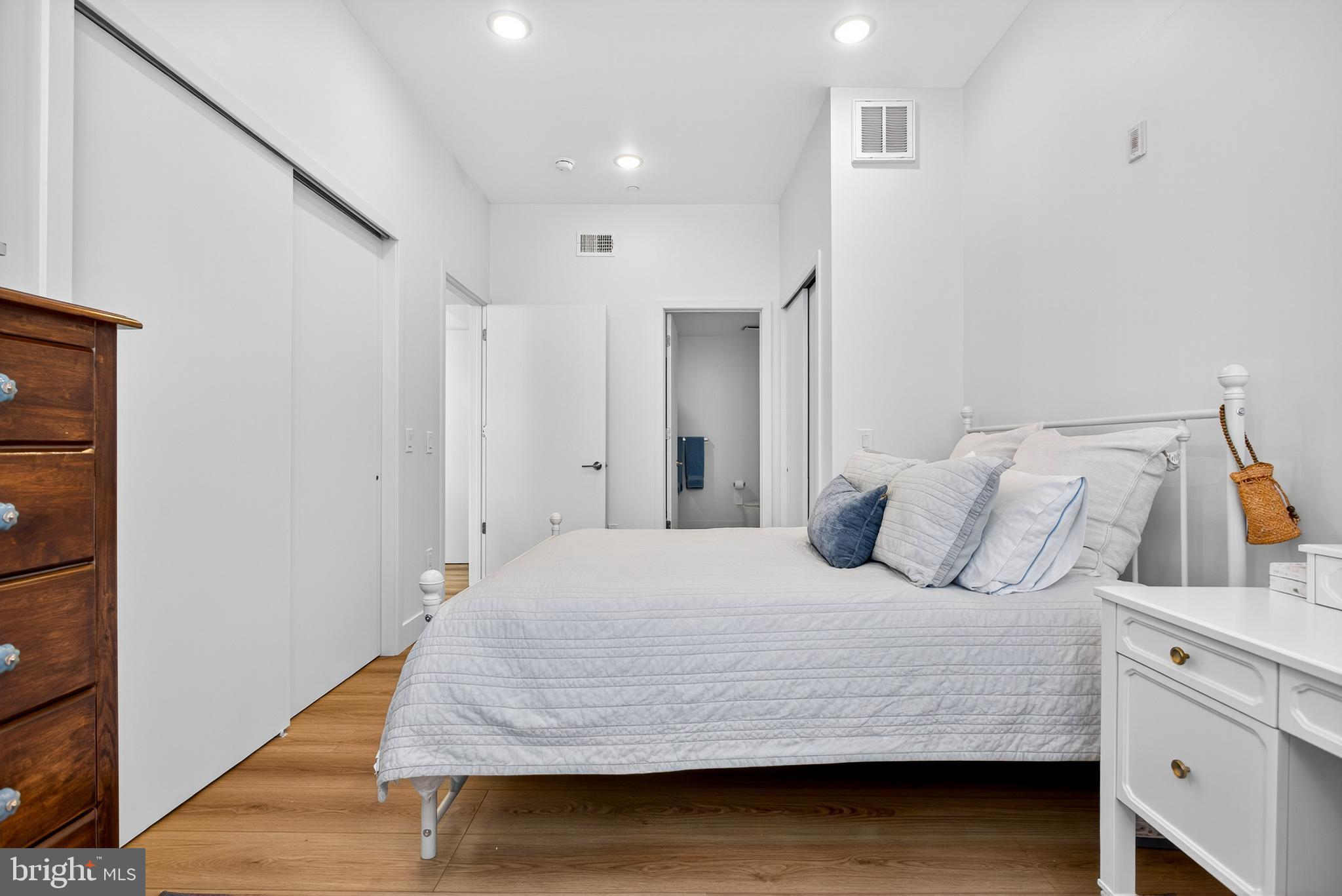 300 Christian Street, Unit 311 Philadelphia, PA 19147 - Photo 13 of 30 a bedroom with a bed and cabinet