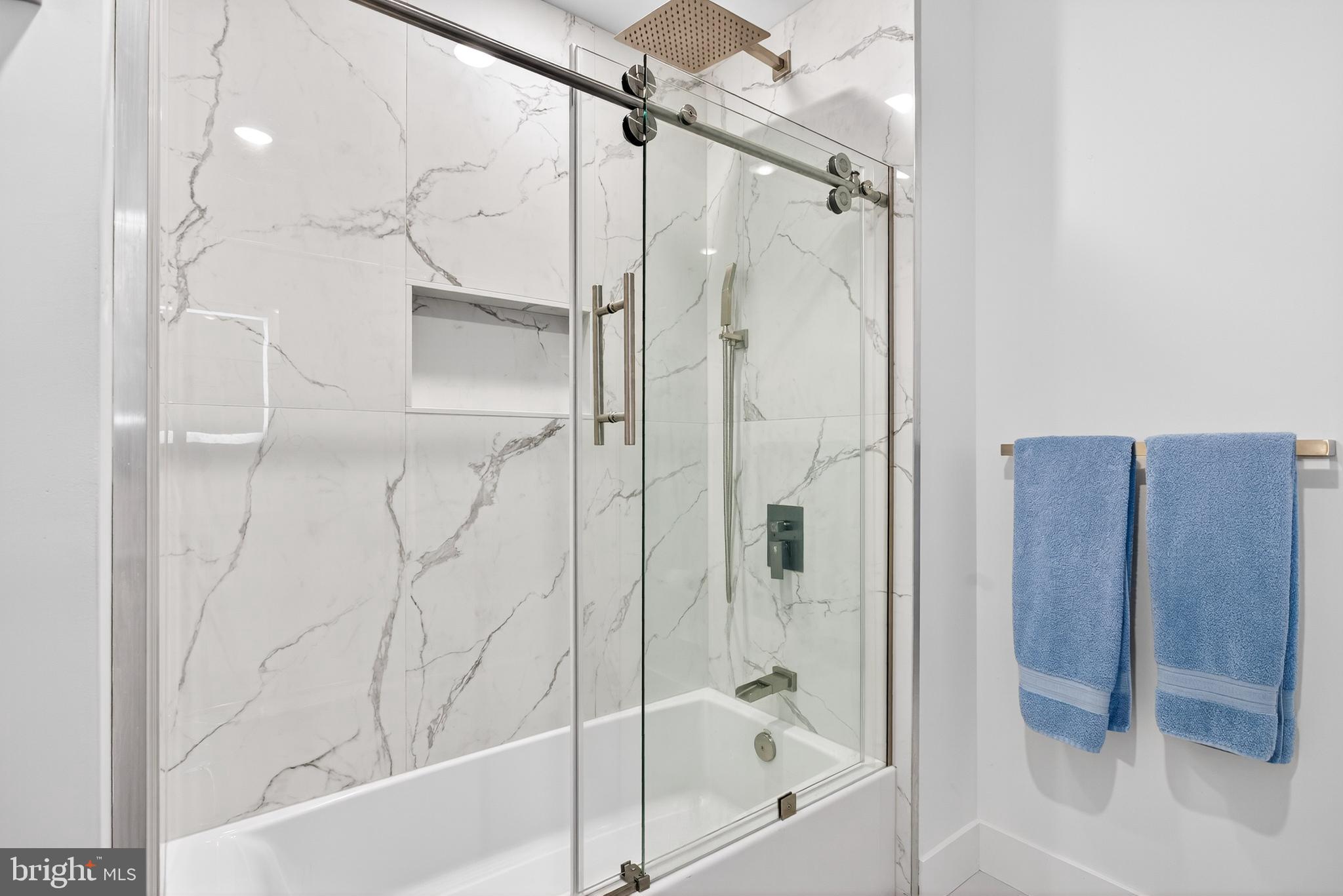 300 Christian Street, Unit 311 Philadelphia, PA 19147 - Photo 15 of 30 a bathroom with a bathtub and a shower