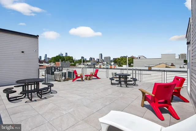 a view of roof deck with seating area