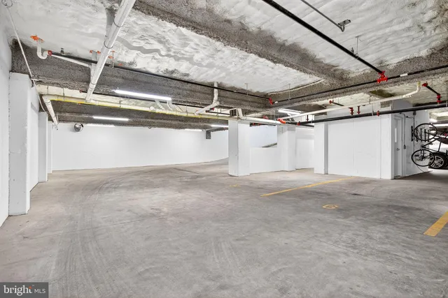 a view of garage with cars