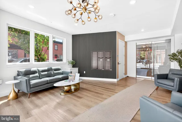a living room with furniture and a large window