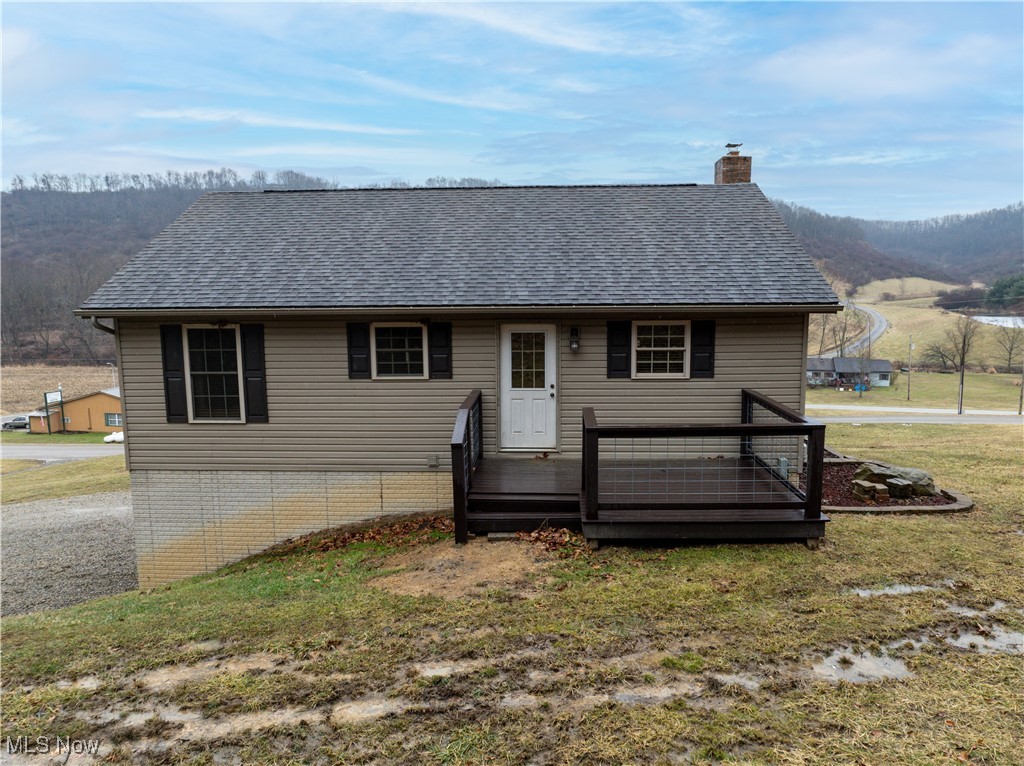 Back view of home with deck area